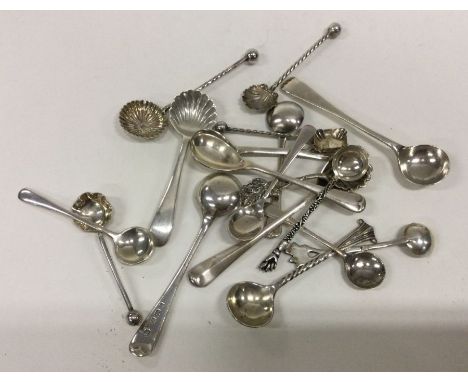 A large collection of silver salt spoons. Various dates and makers. Approx. 61 grams. Est. £30 - £40.