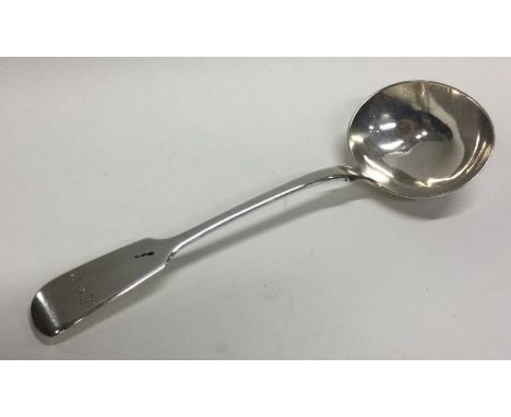 A fiddle pattern silver sauce ladle. London. By RW. Approx. 52 grams. Est. £40 - £60.