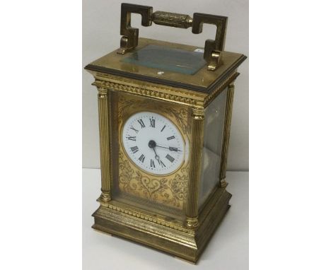 A good brass carriage clock with striking movement. By Charles Frodsham. London. Est. £50 - £80.