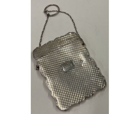 A fine Victorian silver engine turned silver card case with suspended chain. 1848. Approx. 73 grams. Est. £120 - £150.