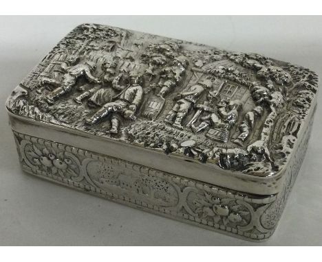 A finely chased Victorian silver snuff box embossed with musicians bearing import marks. Sheffield 1894. By SBL. Approx. 142 