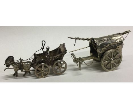 Three novelty silver toy carts. Approx. 88 grams. Est. £30 - £50.