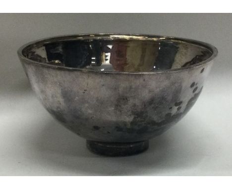 A textured silver bowl on pedestal foot. London. Approx. 40 grams. Est. £50 - £80.