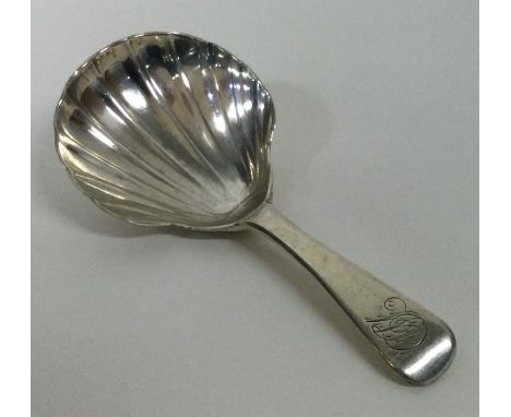 An OE pattern silver caddy spoon. London 1829. By JH. Approx. 14 grams. Est. £20 - £30.