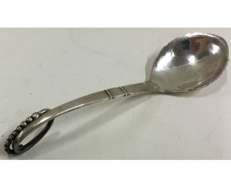 GEORG JENSEN: A silver ladle bearing import marks. Approx. 22 grams. Est. £30 - £50.