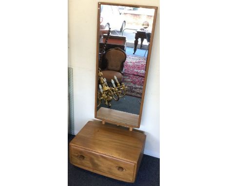 ERCOL: An unusual single drawer dressing mirror. Est. £100 - £150.