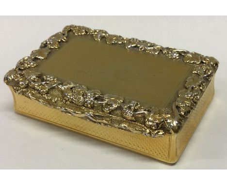 EDINBURGH: A heavy William IV silver gilt engine turned snuff box embossed with grapes and hunting scenes. 1833. By James Nas