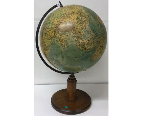 An old globe on wooden base. Est. £30 - £40.