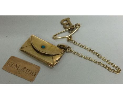 A small 15 carat gold stamp envelope on fine link chain. Approx. 3.2 grams. Est. £50 - £80.