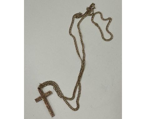 A 9 carat cross on fine link chain. Approx. 5 grams. Est. £50 - £80.