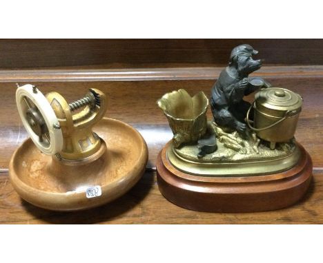 An unusual brass mounted inkwell together with a walnut nut cracker. Est. £20 - £30.