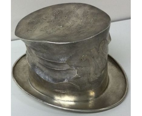 An unusual early 20th Century novelty silver gentleman's hat embossed with a harp. Approx. 245 grams. Est. £600 - £800.