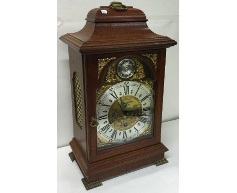 A twentieth century mahogany mounted mantle clock. Est. £20 - £30.