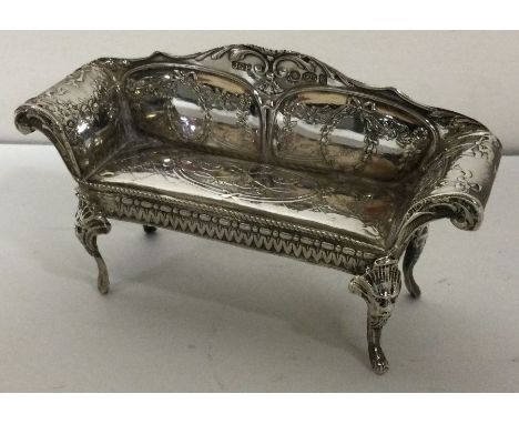 A novelty large silver chair bearing import marks. Approx. 36 grams. Est. £80 - £100.