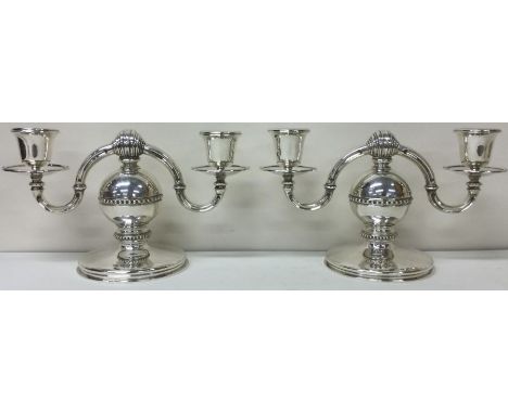 A heavy and decorative pair of silver candelabras. Birmingham 1970. By AJA. Approx. 1819 grams. Est. £1500 - £2000.