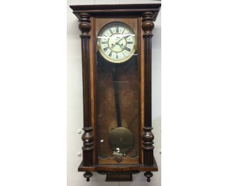 A mahogany Vienna wall clock. Est. £50 - £80.