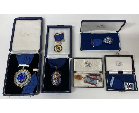 A good quality silver and enamel medallion contained within a fitted box together with numerous other medallions. Est. £80 - 