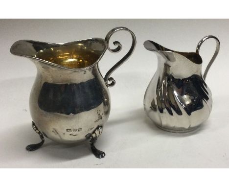 A silver cream jug with gilt interior. By JD&amp;S. Approx. 32 grams. Est. £30 - £40.