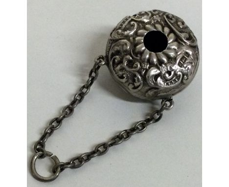 A novelty silver chased babies rattle with suspended chain. Birmingham 1900. Approx. 7 grams. Est. £30 - £50.