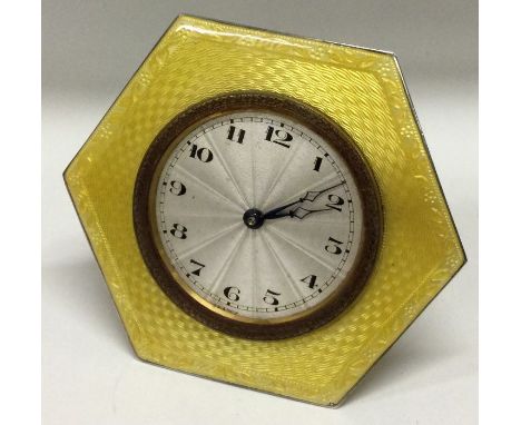 A good Victorian silver and yellow enamelled desk clock. Birmingham 1900. By M Bros Ltd. Approx. 119 grams. Est. £200 - £250.