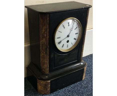 A large slate clock with white enamelled dial. Est. £30 - £40.