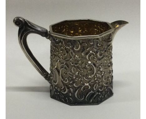 An attractive silver cream jug with floral decoration. Birmingham. Approx. 44 grams. Est. £30 - £40.