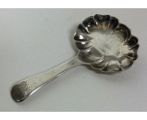 A silver caddy spoon with unusual bowl. London 1807. By DU&amp;NH. Approx. 11 grams. Est. £30 - £40.
