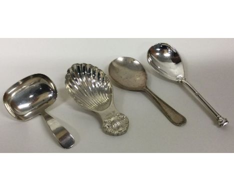 Four silver caddy spoons. Sheffield 1925, 1945, 1969 and Birmingham 1919. Approx. 77 grams. Est. £60 - £80,
