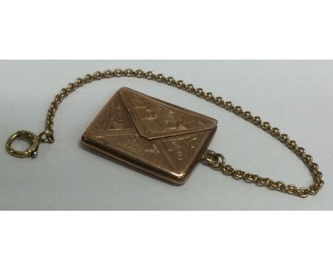 A small gold stamp envelope on suspension chain. Approx. 5 grams. Est. £80 - £120.