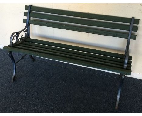 An old cast iron garden bench. Est. £30 - £40.