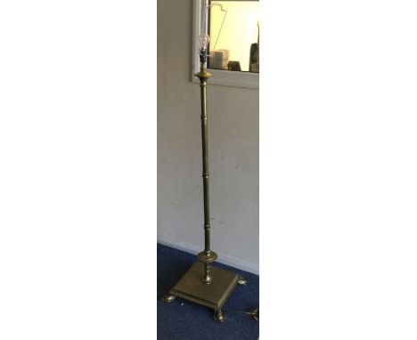 An old brass lamp. Est. £20 - £30.