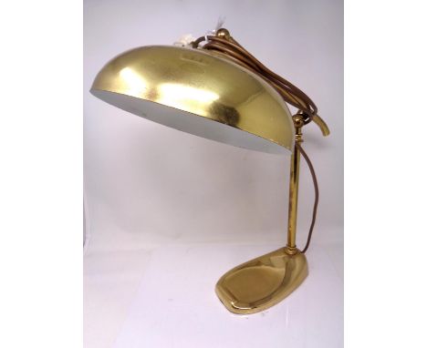 A brass desk lamp.