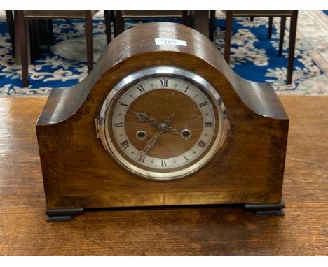 An early 20th century oak mantel clock