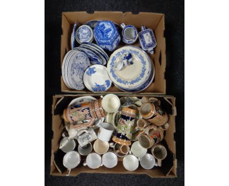 Two boxes containing miscellanea including blue and white ceramics, Ringtons caddy beer steins, commemorative mugs.