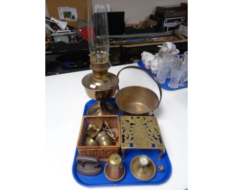 A tray containing antique and later metalware including an Aladdin brass oil lamp with chimney, a brass cast iron handle jam 