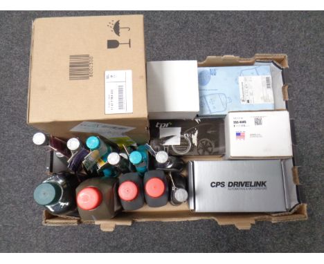 A box containing Petronas engine products, brake fluid, car parts etc.
