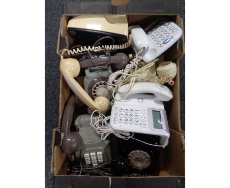 A box of Rotary dial and buttoned telephones 