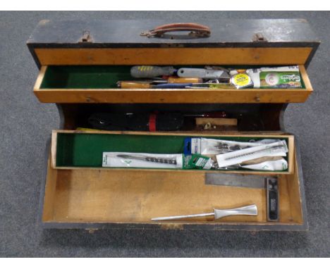 A vintage joiners toolbox containing assorted hand tools, Rabone set square, drill bits.