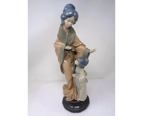 A Nao figure - Geisha with child.