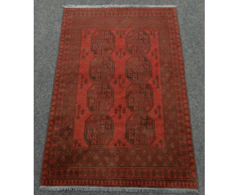 WASHED RED AFGAN DOUBLE KNOT RUG with traditional Bukhari design, 123 x 179cms