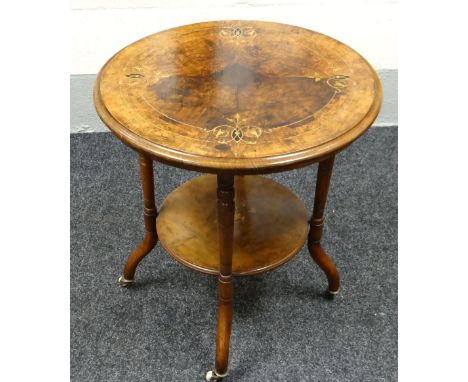 AN EDWARDIAN WALNUT MARQUETRY TOP TABLE of circular form with lower platform & on ceramic castors, 58cms diam