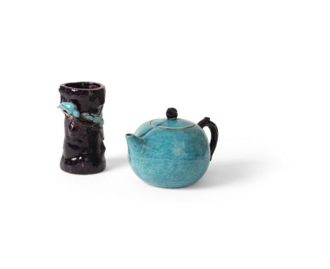 TWO AUBERGINE AND TURQUOISE GLAZED PORCELAIN ARTICLESKANGXI PERIOD the first a teapot, the cover in the shape of a peach surm