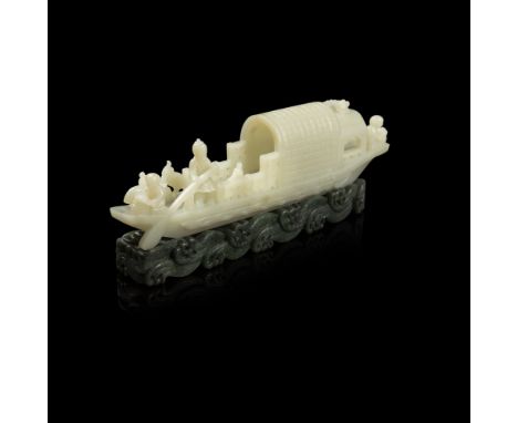 CELADON JADE CARVING OF A SAMPANcarved in openwork as a fishing boat riding across whirling waves carved in spinach-green jad