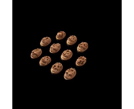 GROUP OF ELEVEN CARVED NUT PLAQUESQING DYNASTY, 19TH CENTURY each of oval shape and skilfully carved, seven depicting two fig