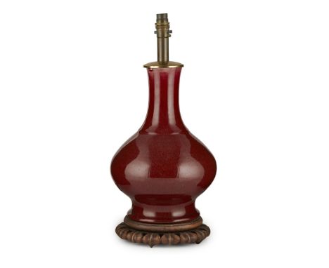 LANGYAO RED-GLAZED BOTTLE VASEQING DYNASTY, 18TH/19TH CENTURY the compressed pear-shaped body rising to a tall slightly waist