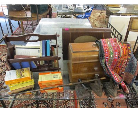 A mixed lot to include a vintage walnut cased radio, a walnut cased sewing machine, books, a magazine rack, three flat irons,