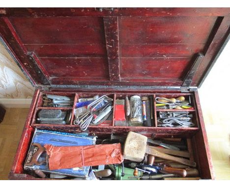 A 19th century travelling chest with internal drawers, containing a large amount of vintage and later workshop tools