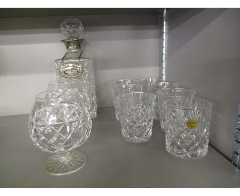 A selection of cut glasses to include brandy glasses and a decanter