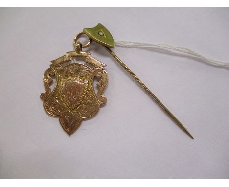 A 9ct rose gold watch fob, 9.1 grams, together with a diamond and yellow metal stick pin