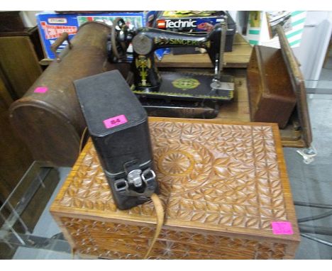 A leather cased Fujica 8 camera, a Singer sewing machine and a treen carved box, 9 h x 18 w